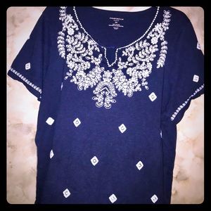 Navy blue blouse with with white diamond accents.
